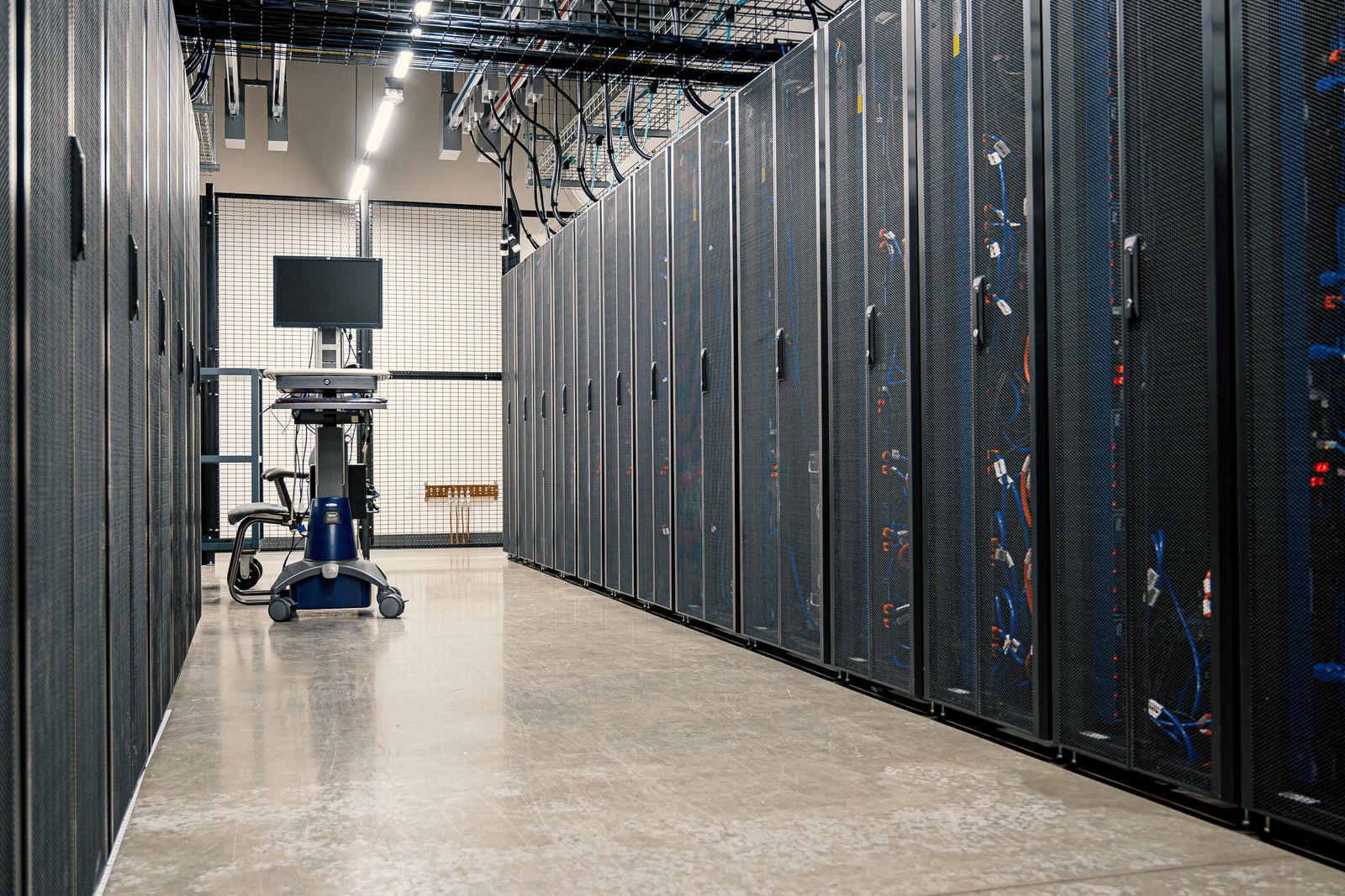 Rows of server racks in a data centre corridor